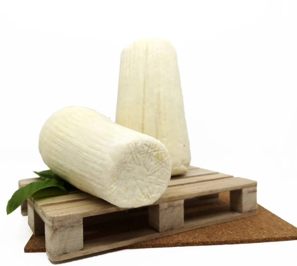 Ricotta Sarda Stagionata 3 kg on a wooden pallet with a fresh herb decoration.