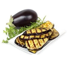 Melanzane Grigliate in olio, grilled eggplant slices garnished with herbs on a plate.