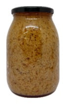 Paté di Melanzane in Olio di semi di Girasole in a glass jar, showcasing its rich, textured appearance.
