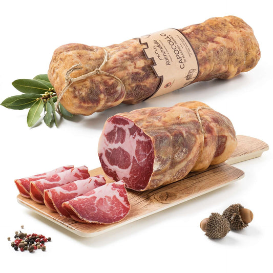 Copollo Pugliese di Martina Franca displayed alongside slices on a wooden board with spices.