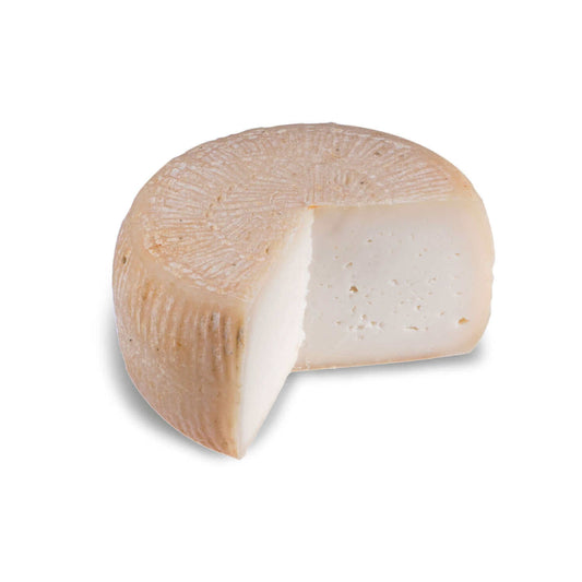 Formaggio di Capra - Semihard cheese with a cut piece, showcasing its creamy texture.