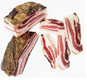 Pancetta Tesa, sliced and whole pieces showcasing the artisanal workmanship and rich color of Calabrian meat.