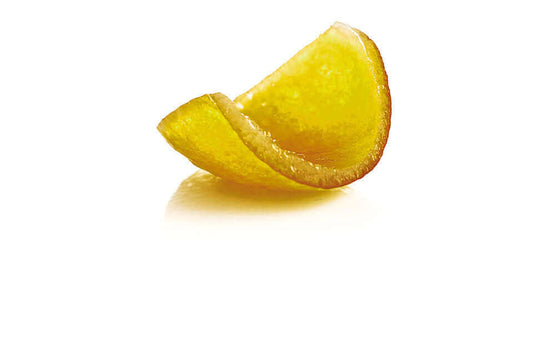 Bucce candite di Bergamotto - pezzo di scorza di bergamotto candita, giallo brillante, con irregolarità.