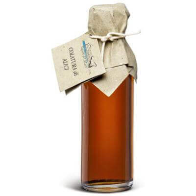 Bottle of Colatura di Alici, a 100 ml seafood seasoning from Sicily, showcasing its rich color and traditional packaging.