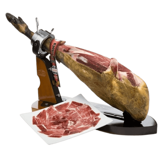 Sliced Jamón Ibérico with whole leg on a traditional ham holder, ready for serving.
