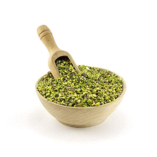 Pistacchio Sicilia - Granella in a wooden bowl with a scoop, ideal for cooking and pastry.