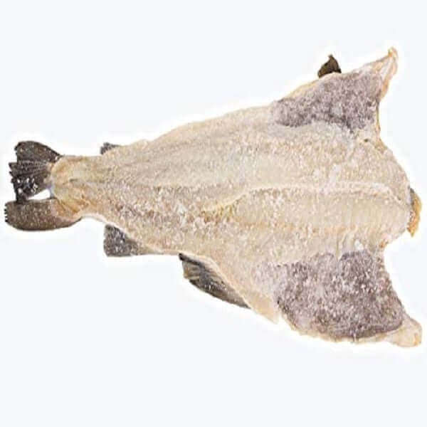 Salted dried fish lying flat on a white background