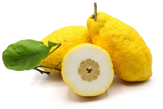 Cedri Calabresi - Freschi, giant citrus fruit, fresh yellow cedri cut in half, showcasing thick peel and juicy flesh.