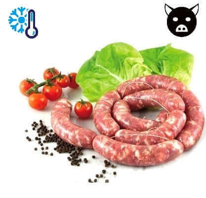 Raw pork sausages with lettuce, cherry tomatoes, and black peppercorns, highlighting freshness and refrigeration.